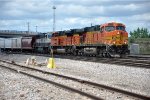 Grain train rolls east past University